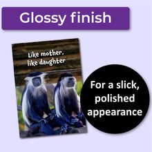 Load image into Gallery viewer, Greeting card with two monkeys and text &#39;Like mother, like daughter&#39; on a wooden background. A purple banner at the top that says, &quot;Glossy finish&quot; and a black circle with text that says, &quot;For a slick, polished appearance.&quot;
